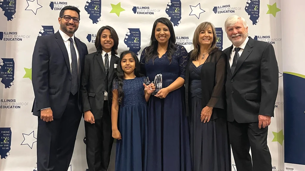 Dr. Mahmood celebrates her
Teacher of the Year recognition
with her family at the Those Who Excel & Teacher of the Year awards event.